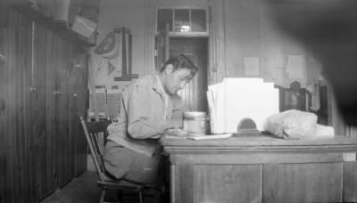 Photograph of Cecil King sitting at a desk