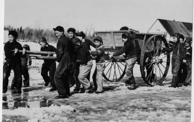 Photograph of students pulling a wagon