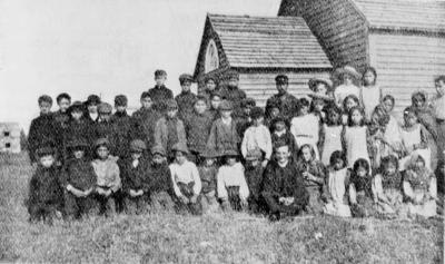 Photograph of school children and staff at Moose Factory