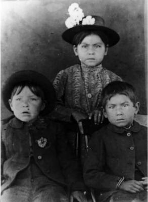 Photograph of three children from Wikwemikong