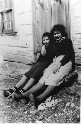 Photograph of Rosemary Wakegijig and Teresa Wakegijig sitting outside at Wikwemikong