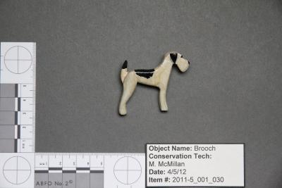 White and black dog brooch