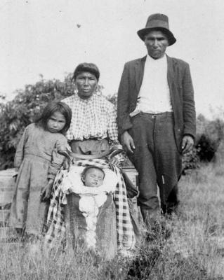 Photograph of a family after a christening