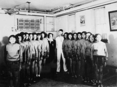 Photograph of girls sports team and coaches