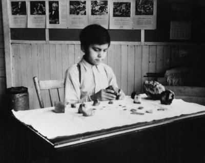 Photograph of Joseph Bennett making handicrafts