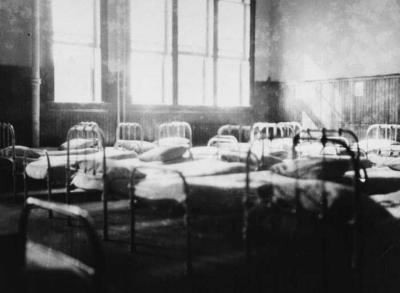 Photograph of the junior dormitory at St John's Residential School
