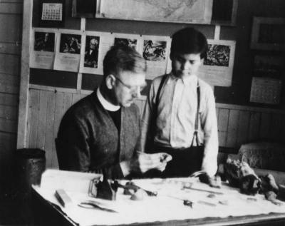 Photograph of Rev. Charles Kehler and Joseph Bennett working on handicrafts