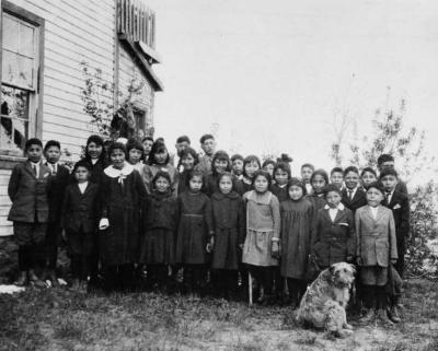 Photograph of a group of students with a dog