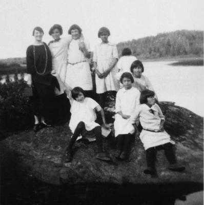 Photograph of students with a teacher beside a river