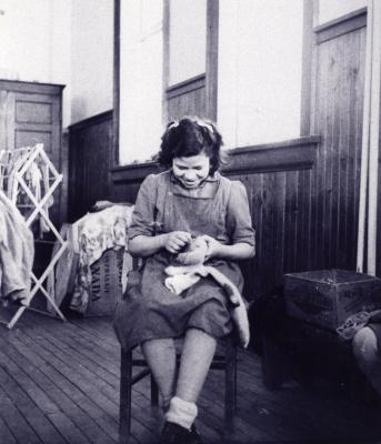 Photograph of Francis Fletcher darning socks