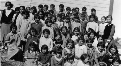 Photograph of Rita Trudeau and her class at Wikwemikong