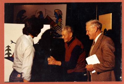 Photograph of Dan Pine Sr. and Brian Fox Wagoosh in front of the rising crane painting