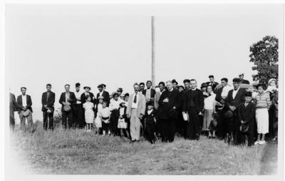 Photograph of a group of people in a field