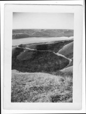 Photograph looking down from the grain fields at Round Lake Indian Residential School