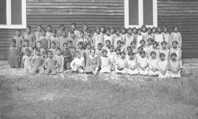 Photograph of student body of St. Philip's school with teacher