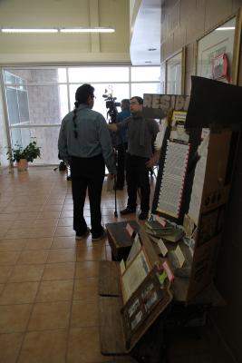 Photographs of on-screen interview at Spanish Residential School reunion