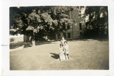 Photographs of children on merry-go-round and children on lawn