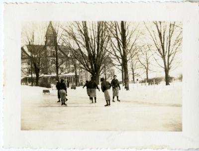 Photograph of girls skating in front of Mt. Elgin School