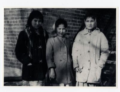 Photograph of Lily Gull, Maggie Gull, and Margaret Trapper behind the school