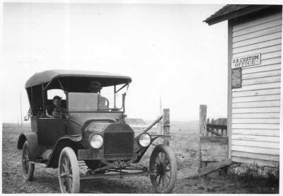 Photographs of a sawmill, Waterton, and US border